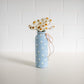 Everlasting Daisies in Blue Vase