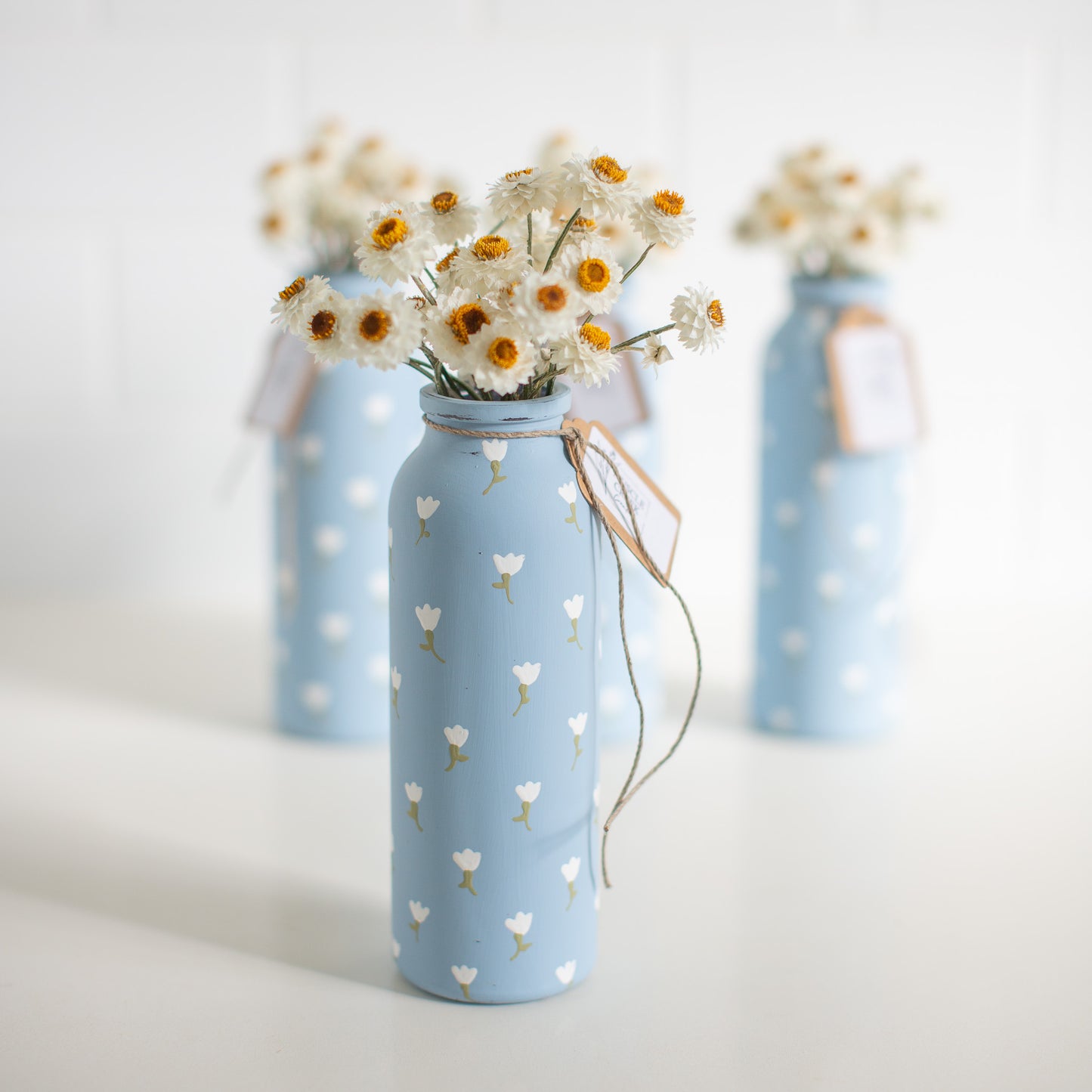 Everlasting Daisies in Blue Vase