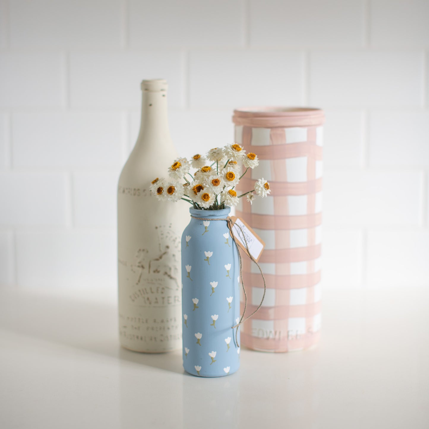 Everlasting Daisies in Blue Vase