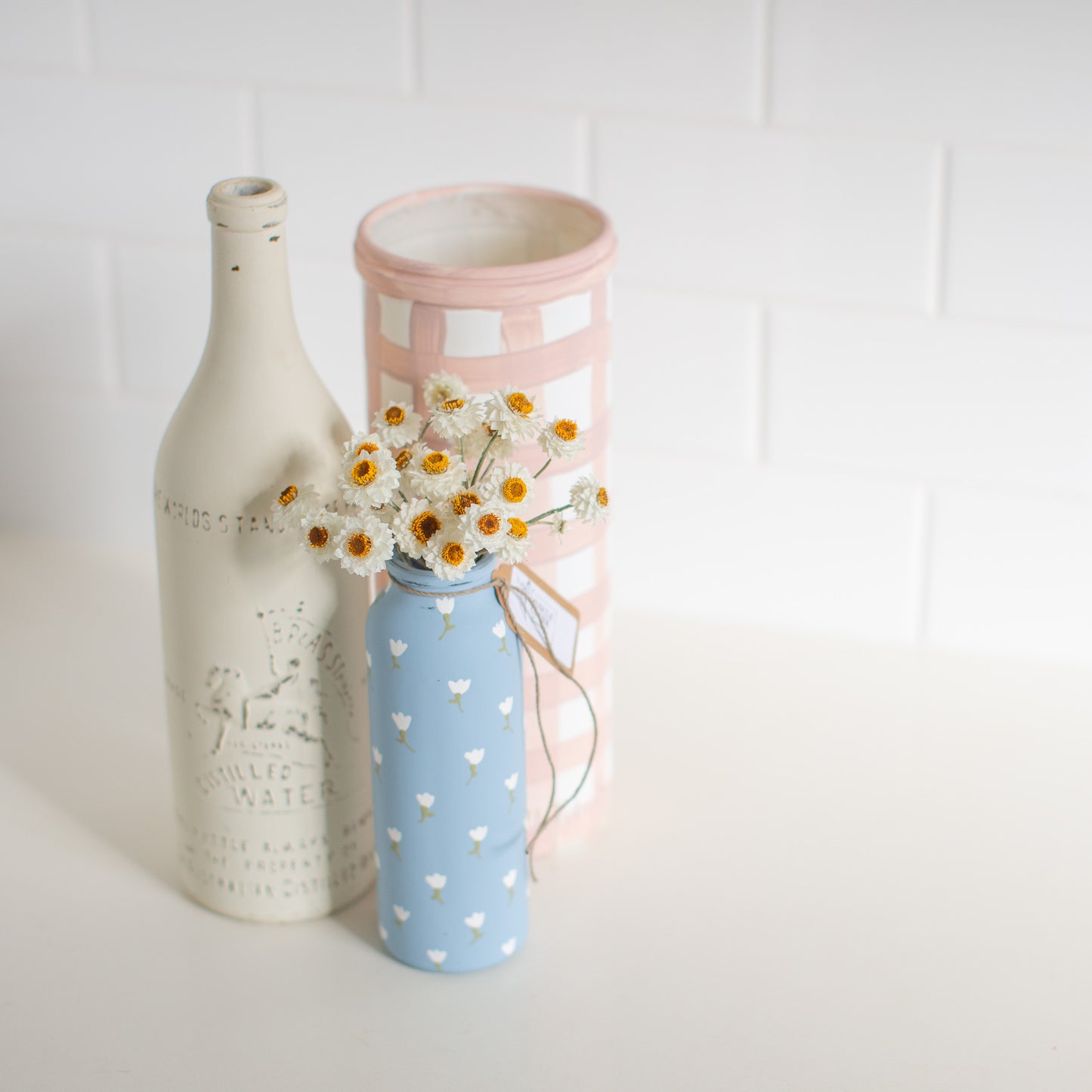 Everlasting Daisies in Blue Vase